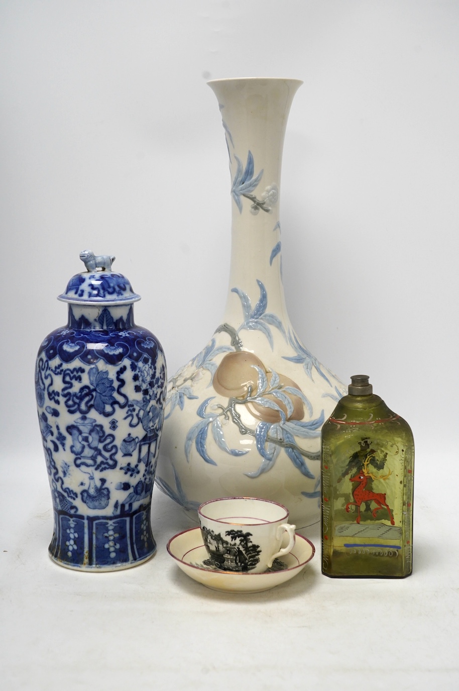 Four ceramic items including a large Lladro vase, 47.5cm high, a Chinese lidded vase, an early 19th century painted bottle and a lustre teacup and saucer. Condition - fair to good